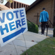 A vote arrives at a polling station at C.T. Martin Natatorium and Recreation Center during the US midterm election, in Tucker, Georgia, on November 8, 2022.